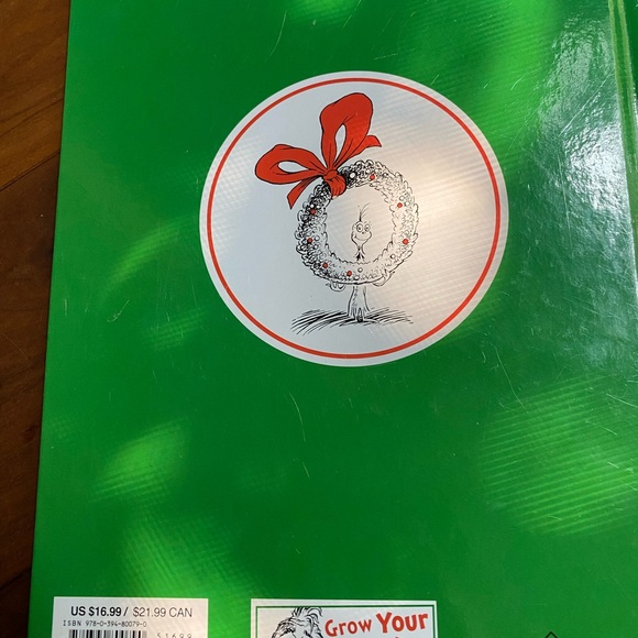 Book next to new How the grinch stole Christmas - Picture 2 of 3